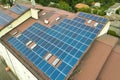 Aerial view of solar power plant with blue photovoltaic panels mounted of apartment building roof Royalty Free Stock Photo