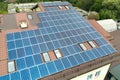 Aerial view of solar power plant with blue photovoltaic panels mounted of apartment building roof Royalty Free Stock Photo