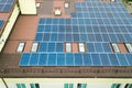 Aerial view of solar power plant with blue photovoltaic panels mounted of apartment building roof Royalty Free Stock Photo