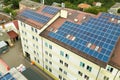 Aerial view of solar power plant with blue photovoltaic panels mounted of apartment building roof Royalty Free Stock Photo