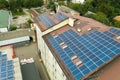 Aerial view of solar power plant with blue photovoltaic panels mounted of apartment building roof Royalty Free Stock Photo