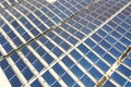 Aerial view of solar power plant with blue photovoltaic panels mounted of industrial building roof Royalty Free Stock Photo