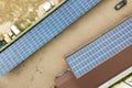 Aerial view of solar power plant with blue photovoltaic panels mounted of industrial building roof Royalty Free Stock Photo