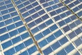 Aerial view of solar power plant with blue photovoltaic panels mounted of industrial building roof Royalty Free Stock Photo