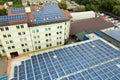 Aerial view of solar power plant with blue photovoltaic panels mounted of industrial building roof Royalty Free Stock Photo