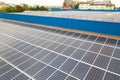 Aerial view of solar power plant with blue photovoltaic panels mounted of industrial building roof Royalty Free Stock Photo