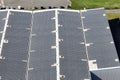 Aerial view of solar power plant with blue photovoltaic panels mounted on industrial building roof for producing green Royalty Free Stock Photo