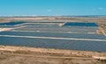 Aerial view of solar power plant. Photovoltaic power station supplying electricity to small town in countryside. Royalty Free Stock Photo