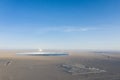 Aerial view of solar thermal power station and transformer substation on desert