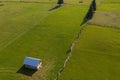 Aerial view of some mountain farm gardens and lawns in the middle of summer during a beautiful day shot in Romania Bucovina Royalty Free Stock Photo