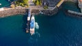 Aerial top down view of the arrival of the ship with tourists in the port bay. sea transport. Sorrento city, tourism concept, vaca