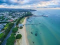 Aerial view of Sorrento Long Pier, moored passenger ferry and suburban houses at dawn.