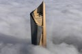 Aerial view of the spectacular Al Hamra tower skyscraper rising above clouds