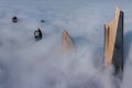 Aerial view of the spectacular Al Hamra tower skyscraper rising above clouds