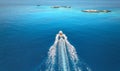 Aerial view of speed boat on blue sea at sunset in summer Royalty Free Stock Photo