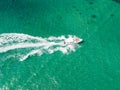 Aerial view of Speed boat at high speed in the aqua sea, Drone view.