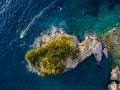 Aerial view of a speedboat hurtling near the island of Sveti Nikola, island of Budva, Montenegro. Jagged coasts Royalty Free Stock Photo