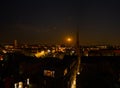 Aerial view of the spire of St. Georges church Southport at night with moon rise