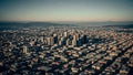 Aerial view of a sprawling city grid with dense urban development and distant mountains Royalty Free Stock Photo