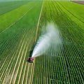 Aerial View of Spring soybean field being sprayed with pesticides by agricultural innovation