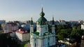 Aerial View of St. Andrews Church, orthodox Church on green hill in the city