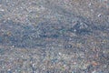 Aerial view of stack of different types of large mountain garbage pile, plastic bags, and trash with a tractor car in industrial