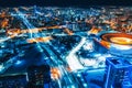 Aerial view of stadium with night illumination and residential buildings Royalty Free Stock Photo