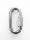 Aerial view of stainless steel safety carabiner isolated on white background. Symmetrical oval carabiner with latch closed in