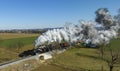 Aerial View of a Steam Double-Header Freight , Passenger Train Approaching Blowing Lots of Smoke