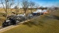 Aerial View of a Steam Double Header Freight and Passenger Train, Traveling Thru Farmlands