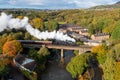 Aerial view of steam engines crossing Brooksbottom Viaduct, near Bury, United Kingdom