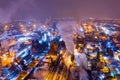 Aerial view of steel plant at night with smokestacks and fire blazing out of pipe. Industrial panoramic landmark with blast furnan Royalty Free Stock Photo