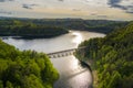 Aerial view of steel underspanned suspension railway bridge over Bobr River in Pilchowice, beautiful lake