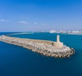 Aerial view of the stone lighthouse standing on the mole