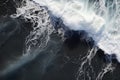 Aerial view of stormy ocean waves breaking on black sand beach, Aerial view of waves on the black sand beach, AI Generated Royalty Free Stock Photo