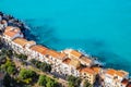 Aerial view of street in Cefalu old town and turquoise sea water on Sicily island, Italy. Medieval seashore village with Royalty Free Stock Photo