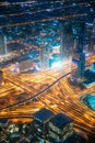 Aerial View Of Street Night Traffic Of Illuminated Cityscape With Skyscraper In Dubai. Urban Background Of Dudai Skyline Royalty Free Stock Photo