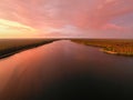 Aerial view of stunning sunset over pine forest and Sajno lake