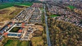 Aerial view of suburban housing development with new construction, roads, and green fields in Harrogate, North Yorkshire Royalty Free Stock Photo