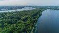 Aerial view summer forest and river in sunny day. Drone shot beautiful nature Royalty Free Stock Photo