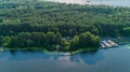 Aerial view summer forest and river in sunny day. Drone shot beautiful nature Royalty Free Stock Photo