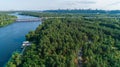 Aerial view summer forest and river in sunny day. Drone shot beautiful nature Royalty Free Stock Photo