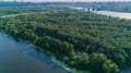 Aerial view summer forest and river in sunny day. Drone shot beautiful nature Royalty Free Stock Photo