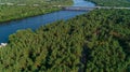 Aerial view summer forest and river in sunny day. Drone shot beautiful nature Royalty Free Stock Photo