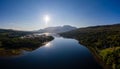 Aerial view of the sun rising above Fort William and the Ben Nevis mountain range in the Scottish Highlands Royalty Free Stock Photo