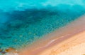 Aerial view of sunny beach and transparent clean sea water