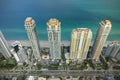 Aerial view of Sunny Isles Beach city with congested street traffic and luxurious highrise hotels and condos on Atlantic