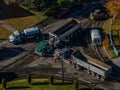 Aerial view of a sunny residential neighborhood featuring repaved roads with construction vehicles. Royalty Free Stock Photo