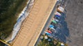 Aerial view of sunrise on gold coast of Long Island, New York, over empty beach with colorful kayaks Royalty Free Stock Photo