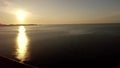 Aerial view sunrise over kiotari beach in Rhodes, greece. Smooth cinematic footage with buildings in the foreground 4k